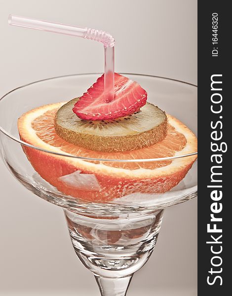 Glass with fresh fruit, concept of healthy drink. Glass with fresh fruit, concept of healthy drink