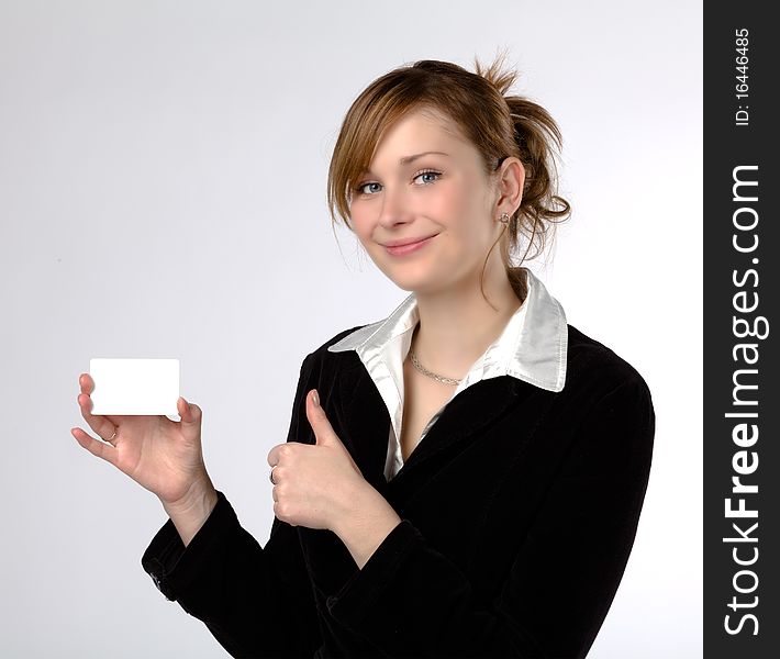 Businesswoman holding a blank card, isolated on a white background