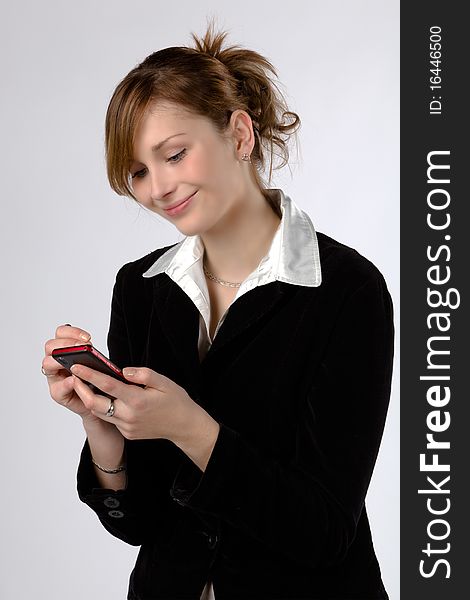 Businesswoman Texting By Phone