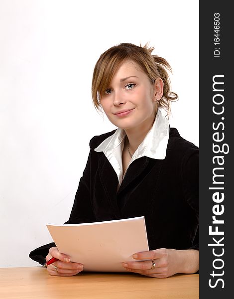 Businesswoman working at a desk, isolated on a white background