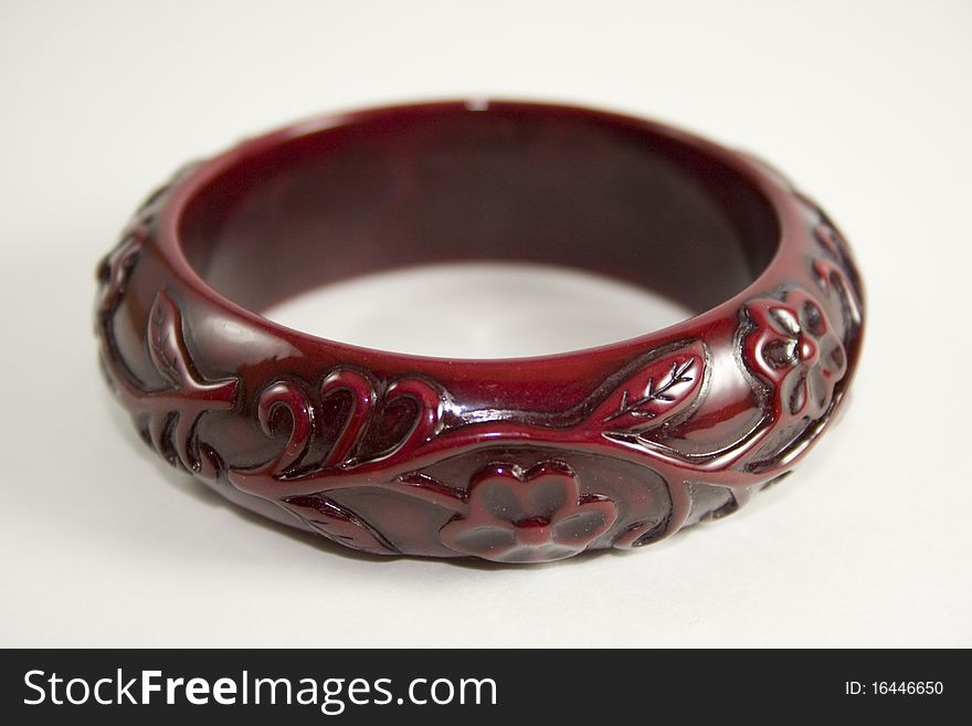 Antique style red bracelet on white background