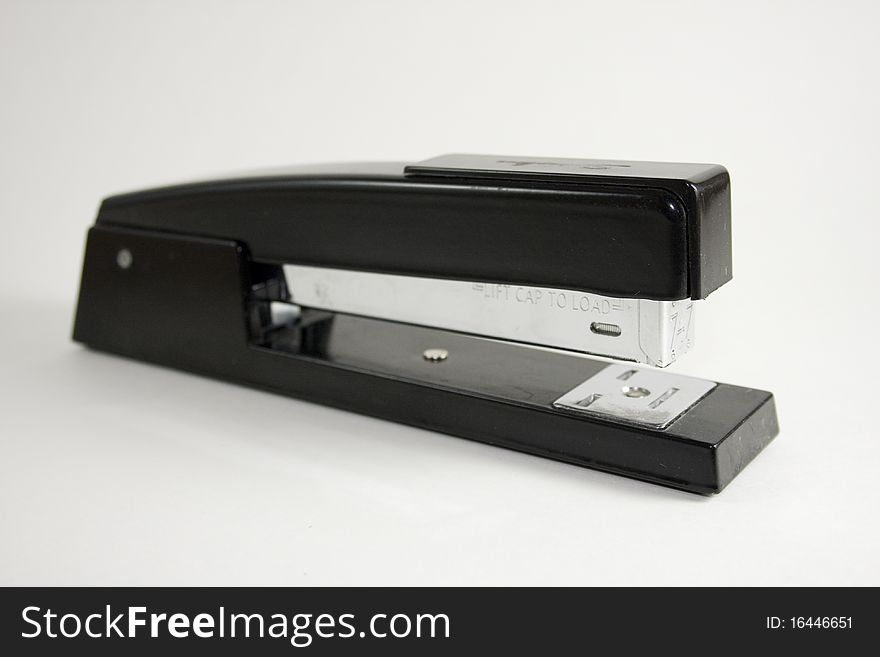 Black office stapler on white background. Black office stapler on white background