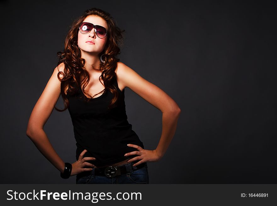 Picture of a young charming active girl on gray background