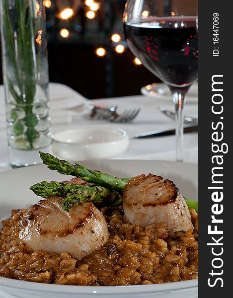 Scallops and asparagus over risotto