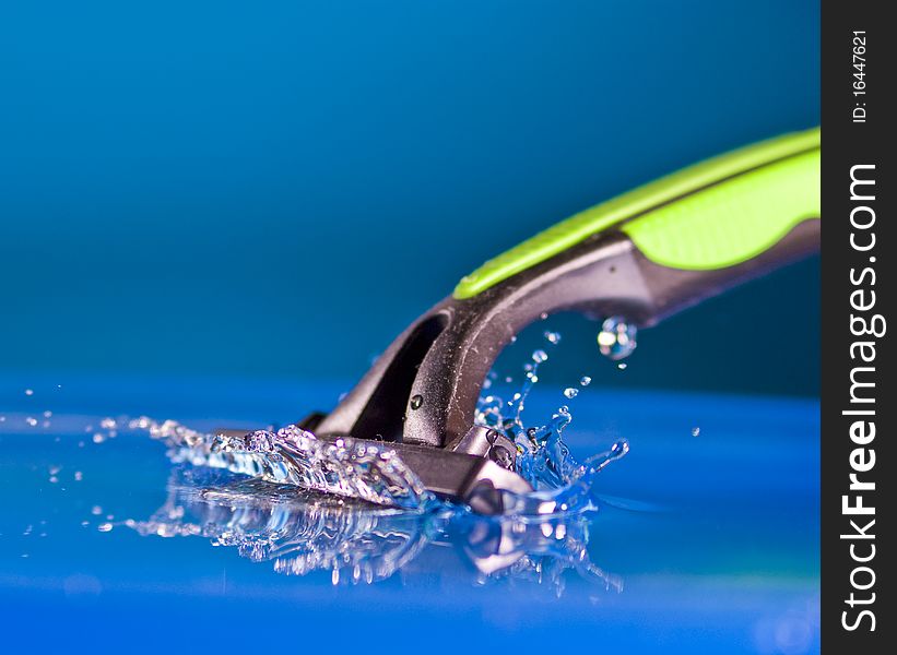 Razor  being cleaned with water