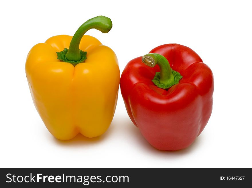 Two bell peppers on white background