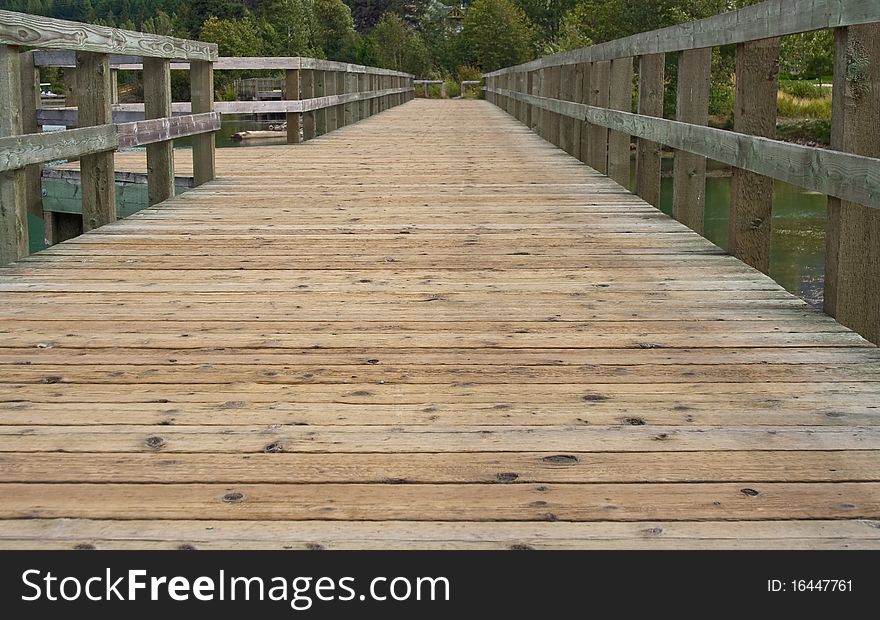 Abstract view showing perspective of a bridge over the pond in the park