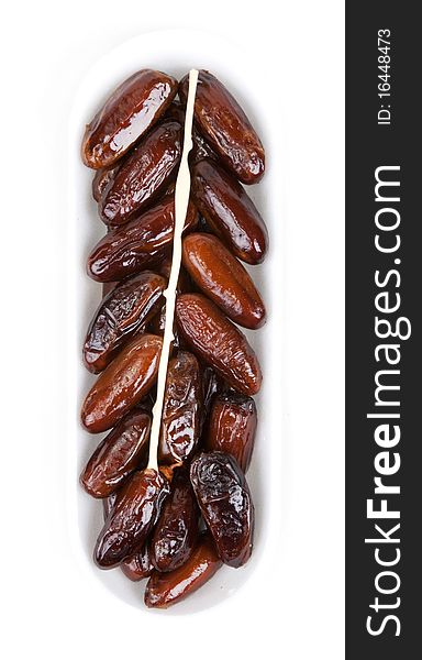 Dates in plastic packing insulated on white background