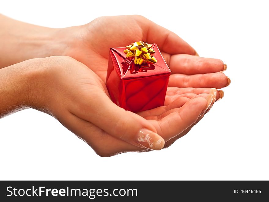 Female hands giving a christmas gift. Isolated on white. Female hands giving a christmas gift. Isolated on white