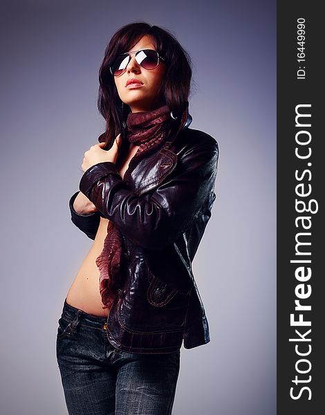 Studio shot of beautiful woman with stylish glasess