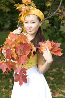 Girl In Autumn Park Stock Photo