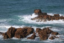 Rocks In The Sea Off The Coast Of Guernsey Stock Images Rocks In The Sea Off The Coast Of Guernsey Stock Images