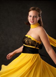 Young Woman In A Yellow Dress Royalty Free Stock Photography