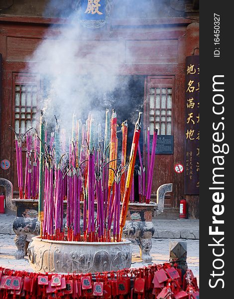 Burning incense in a Confucius Temple in Pingyao