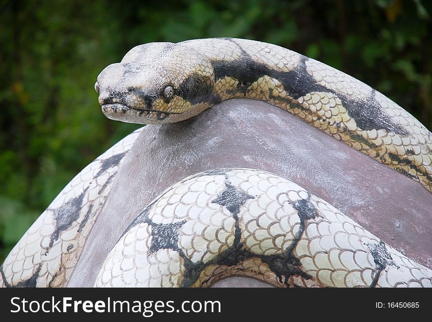 Close up of engraved stone snake at temple