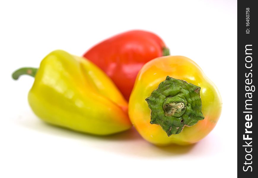 Colorful fresh peppers isolated on white background