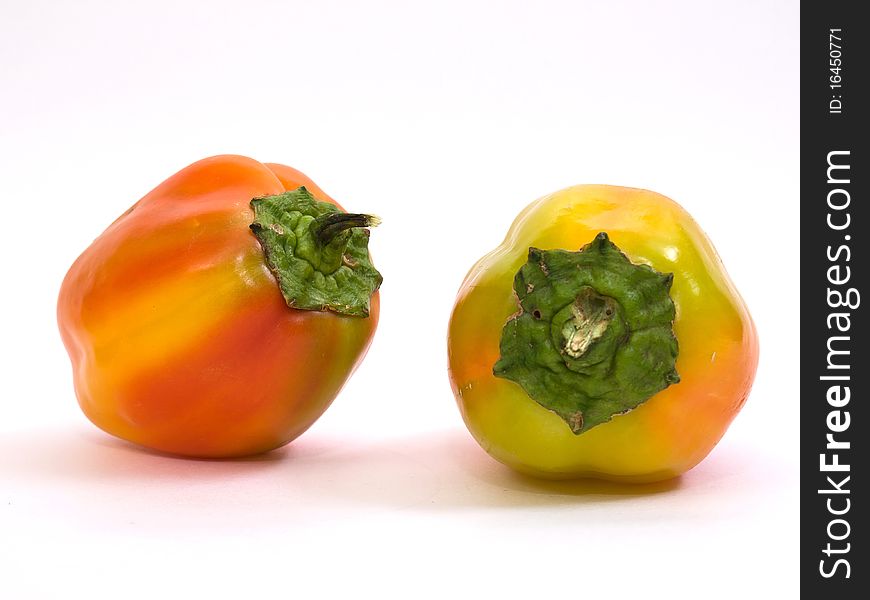 Colorful fresh peppers isolated on white background