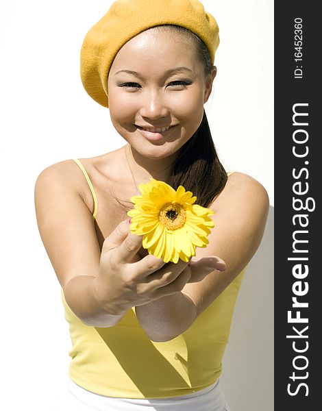 Closeup portrait of a girl with yellow flower. Closeup portrait of a girl with yellow flower