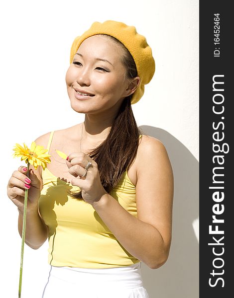 Closeup portrait of a girl with yellow flower. Closeup portrait of a girl with yellow flower
