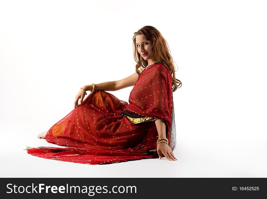 Young Woman In Traditional Dress Sit On White