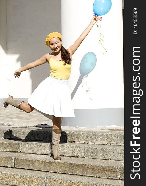 Girl dancing with baloon