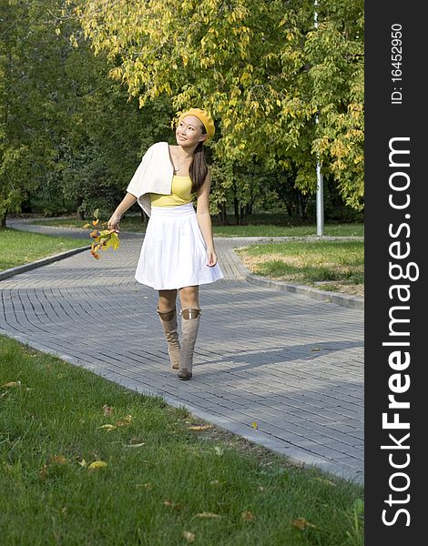 Girl walking in autumn park. Girl walking in autumn park