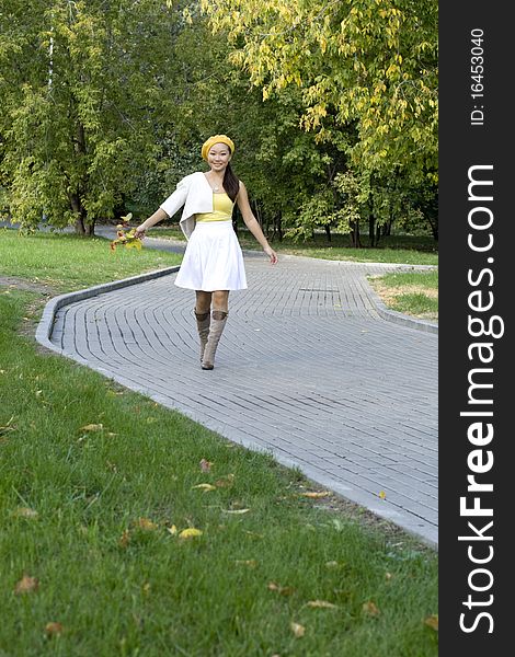 Girl walking in autumn park. Girl walking in autumn park