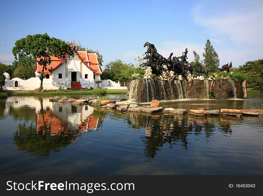 Horse statue, church and pond at Ancient City