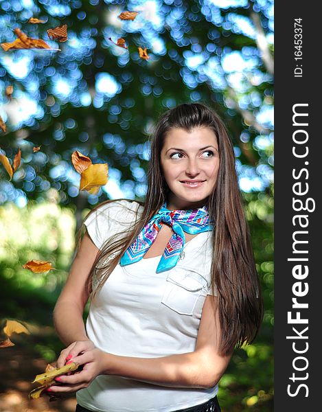 Autumn girl portrait outdoors and forest in the background