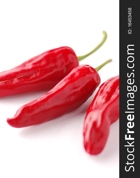 Red hot chili peppers on a white