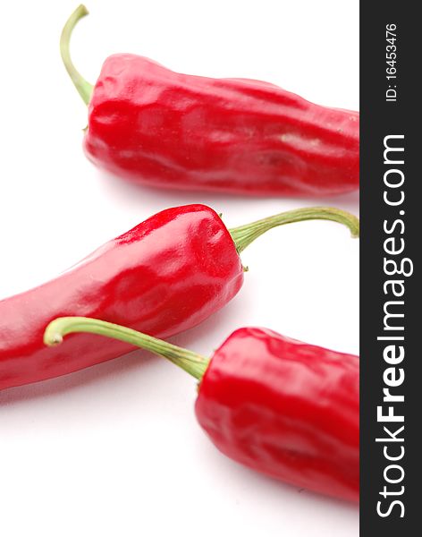 Red hot chili peppers on a white