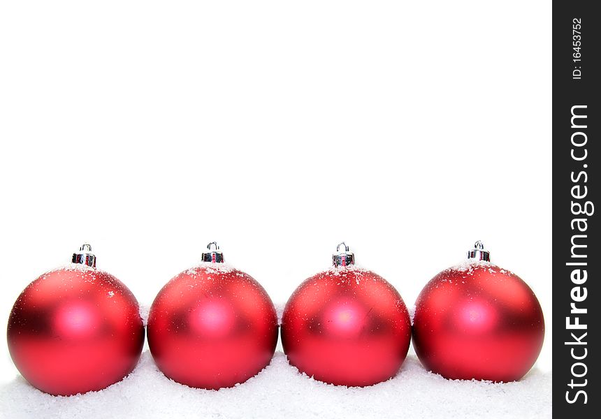 Studio photo of Christmas red glass balls with snow, isolated on white background. Studio photo of Christmas red glass balls with snow, isolated on white background