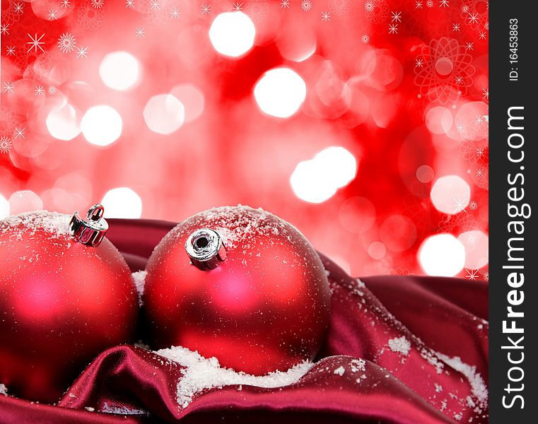 Studio photo of Christmas red glass balls in dark red soft silk with abstract background. Studio photo of Christmas red glass balls in dark red soft silk with abstract background