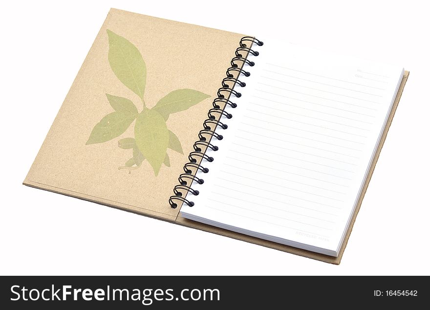 Recycle notebook with tree pattern on cover.