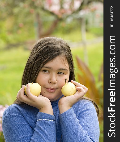Girl holding green apples outdoor. Girl holding green apples outdoor