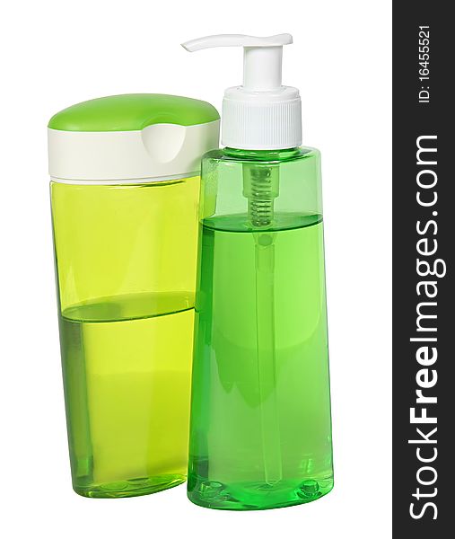 Two green plastic bottles isolated on a white background