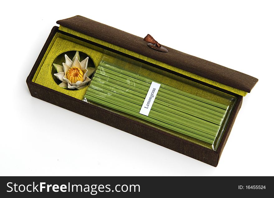 Incense and ceramic lotus incense holder in gift box on white background. Incense and ceramic lotus incense holder in gift box on white background