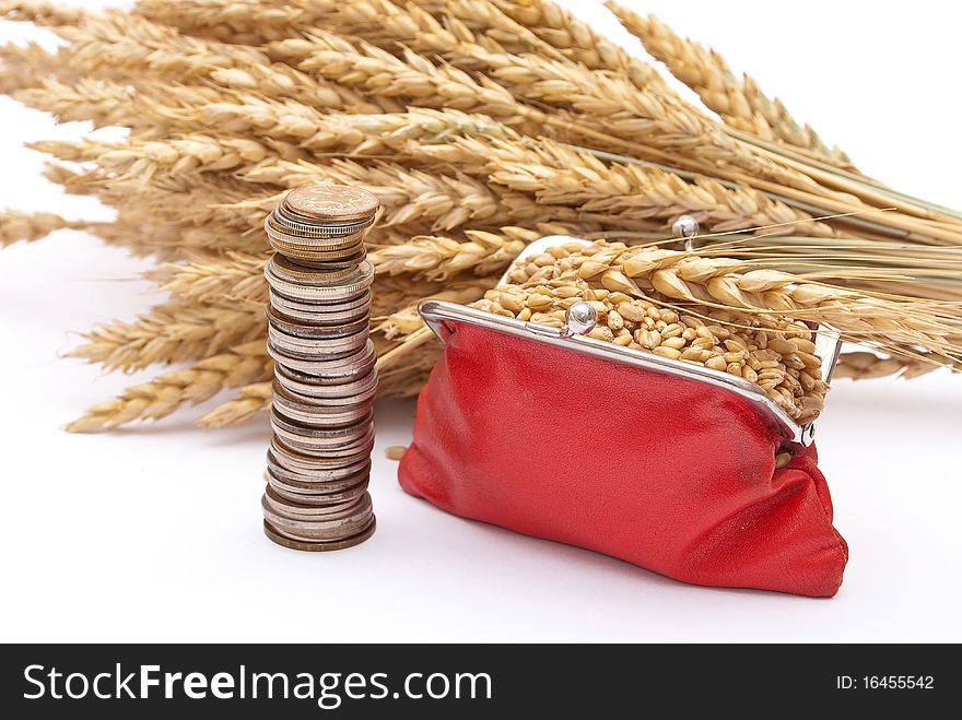 Red purse with wheat ears on white