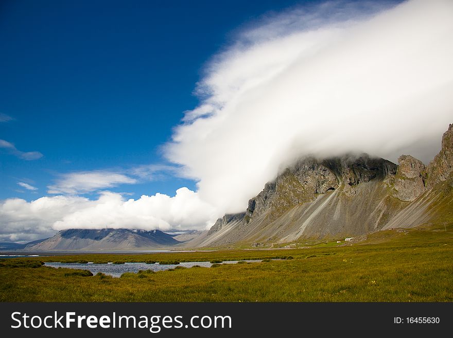 Hvalnes cliffs on south of Iceland - Sunny summer day. Hvalnes cliffs on south of Iceland - Sunny summer day.