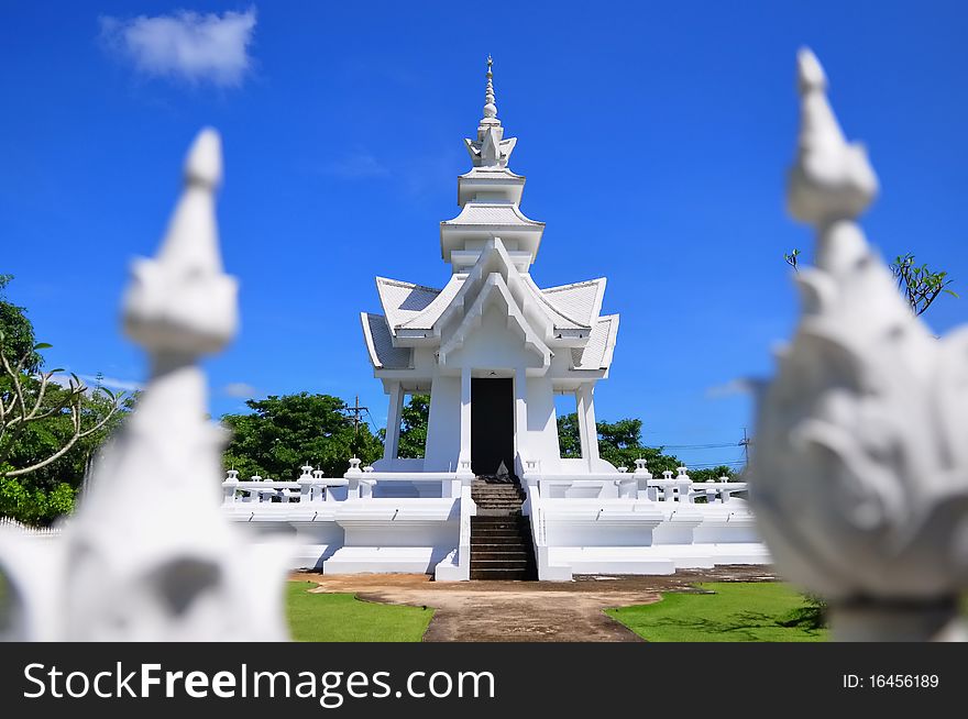 Pavilion of Wat Rong Khun temple against blue sky
