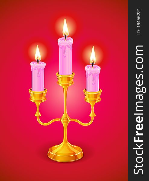 Gold candlestick with three burning candle