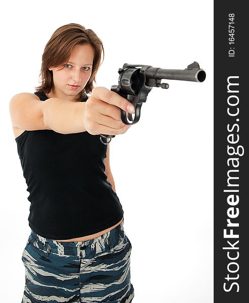 Young woman with a gun isolated on white