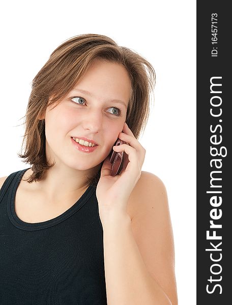 Woman talking on her mobile phone - isolated over a white background. Woman talking on her mobile phone - isolated over a white background
