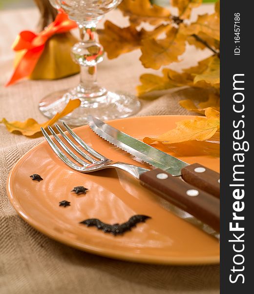 Knife and fork on empty plate,decoration for Halloween. Knife and fork on empty plate,decoration for Halloween