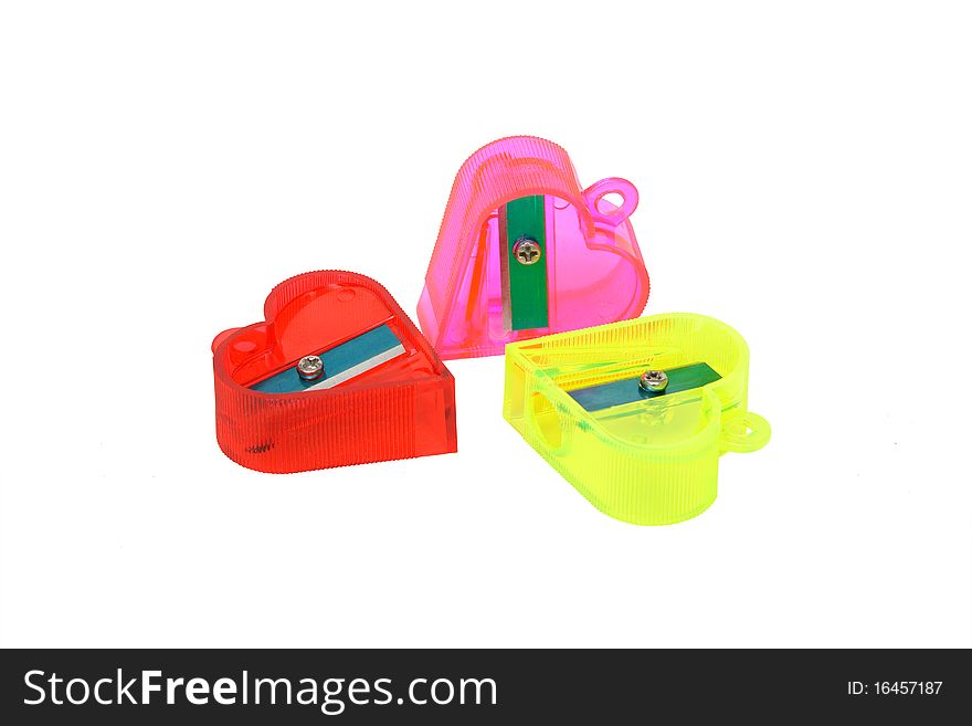 Three translucent plastic sharpeners isolated on a white background. Clipping path included.