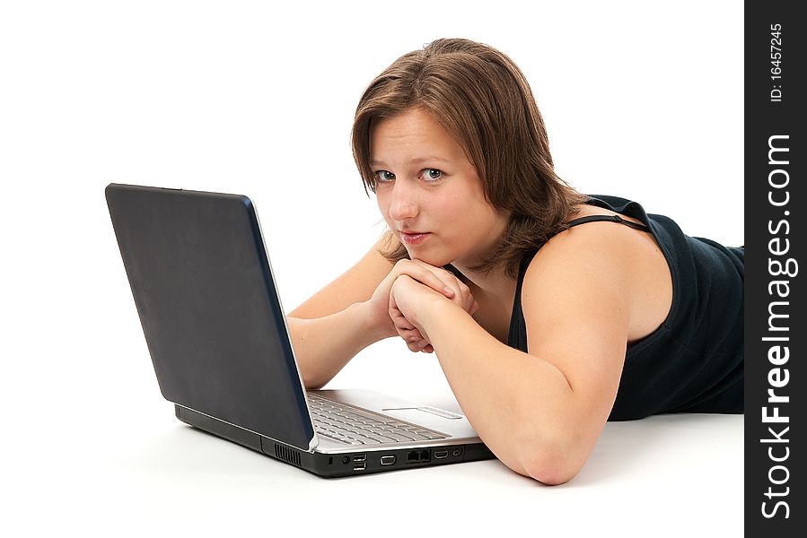 Woman working on a laptop isolated over a white background