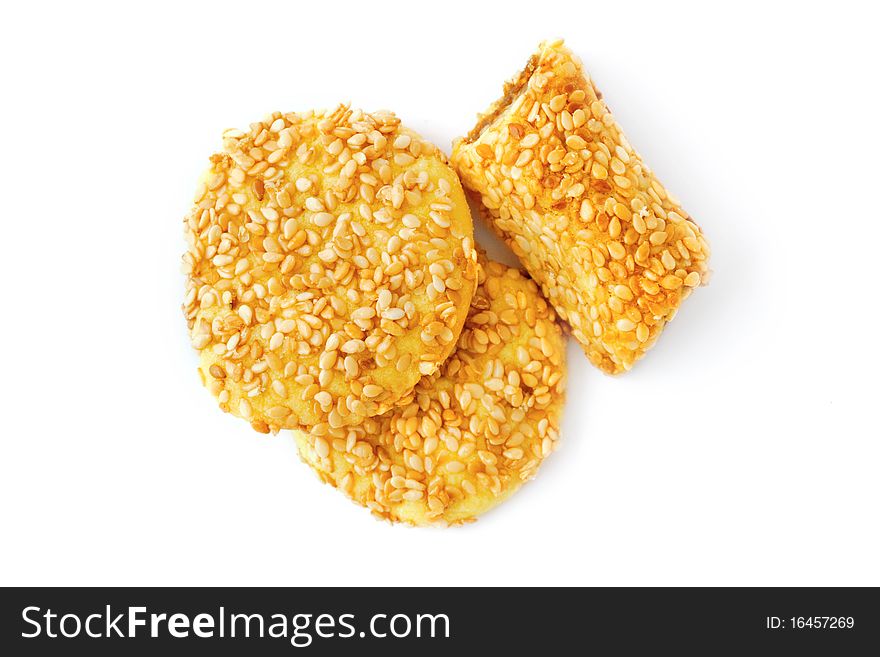 Sweet cookies with sesame seeds isolated on white. Sweet cookies with sesame seeds isolated on white