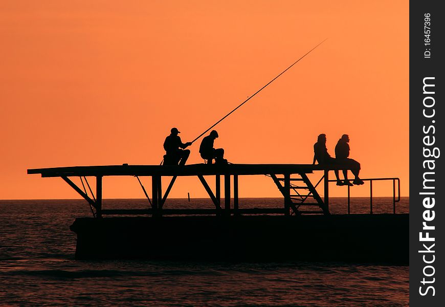 Fishermen on Black Sea at sunset, Sochi