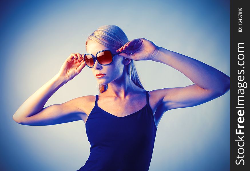 Portrait of a beautiful woman wearing sunglasses. Portrait of a beautiful woman wearing sunglasses