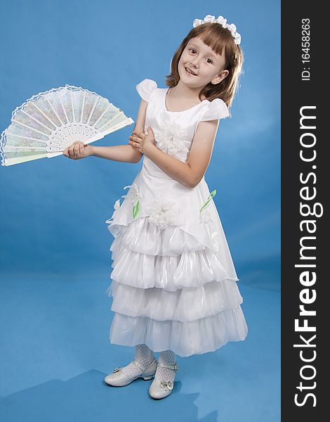 Little Girl holding fan.